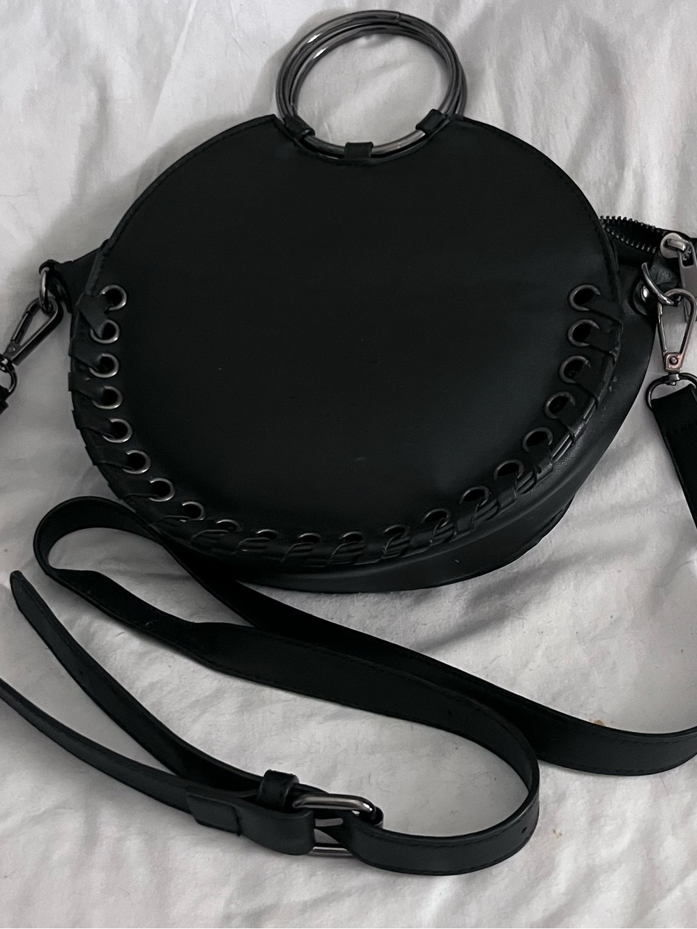 Black Round Crossbody Bag with Ring Handle Shoulder strap can be removed.